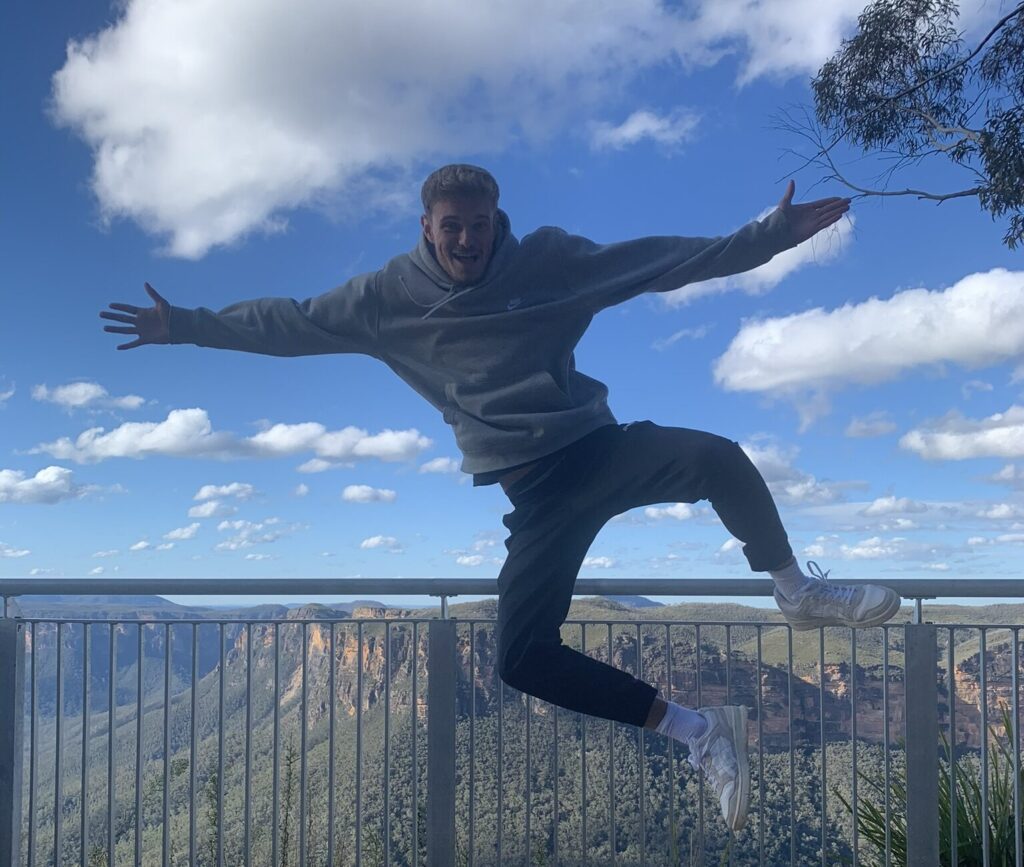 Man jumping in blue mountains, Sydney