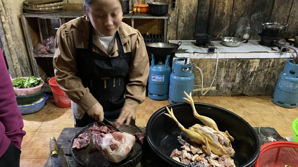 Vietnamese woman cooks chicken curry in Ha Giang in Vietnam