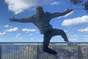 Man jumping in blue mountains, Sydney